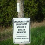 Place signs on trees